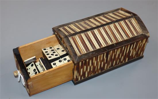 A quill box domino set